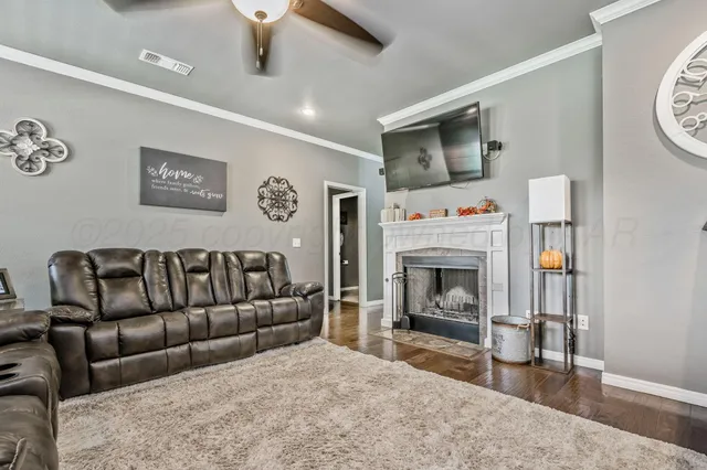 a living room with furniture and a fireplace