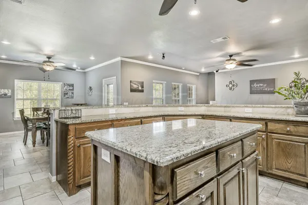 a kitchen with a stove a sink and a refrigerator