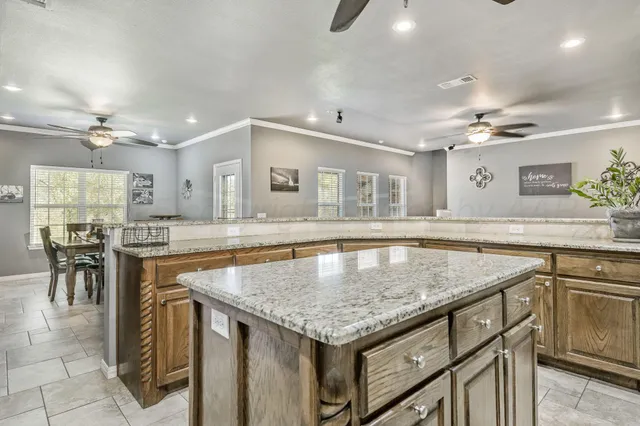 a kitchen with a stove a sink and a refrigerator