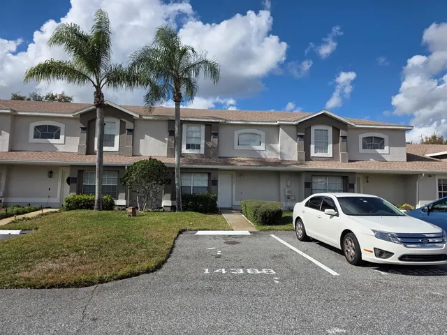 a view of a car parked in front of a house