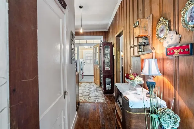 a bedroom with a bed and a wooden floor