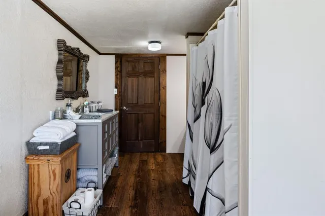 a view of an entryway with wooden floor