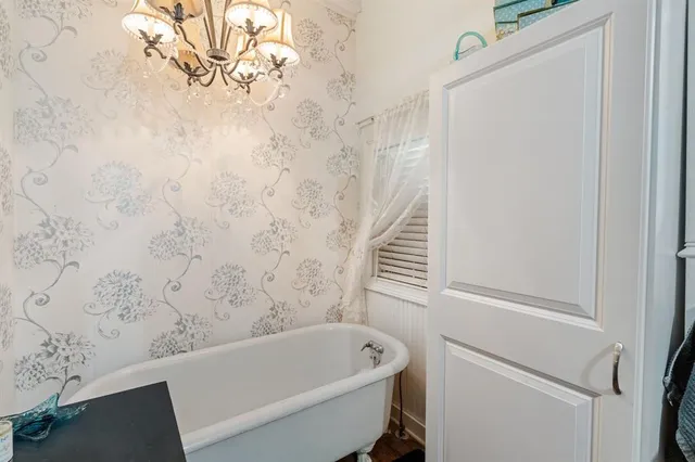 a bathroom with a granite countertop sink toilet and bathtub