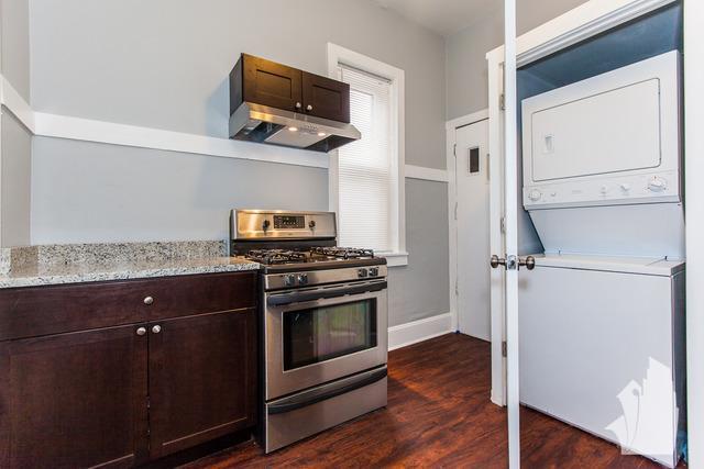Undisclosed Address Chicago, IL 60614 - Photo 4 of 18 a kitchen with wooden floor and steel stainless steel appliances