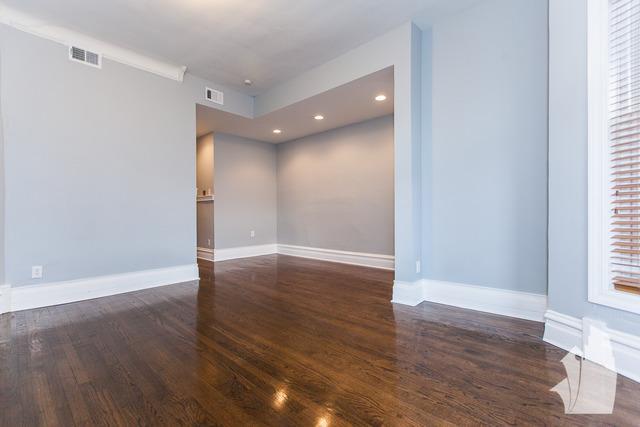 Undisclosed Address Chicago, IL 60614 - Photo 8 of 18 a view of an empty room with wooden floor and a window