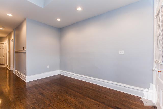 Undisclosed Address Chicago, IL 60614 - Photo 9 of 18 a view of an empty room with wooden floor