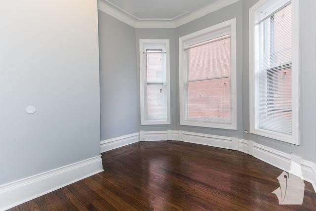 Undisclosed Address Chicago, IL 60614 - Photo 10 of 18 an empty room with wooden floor and windows