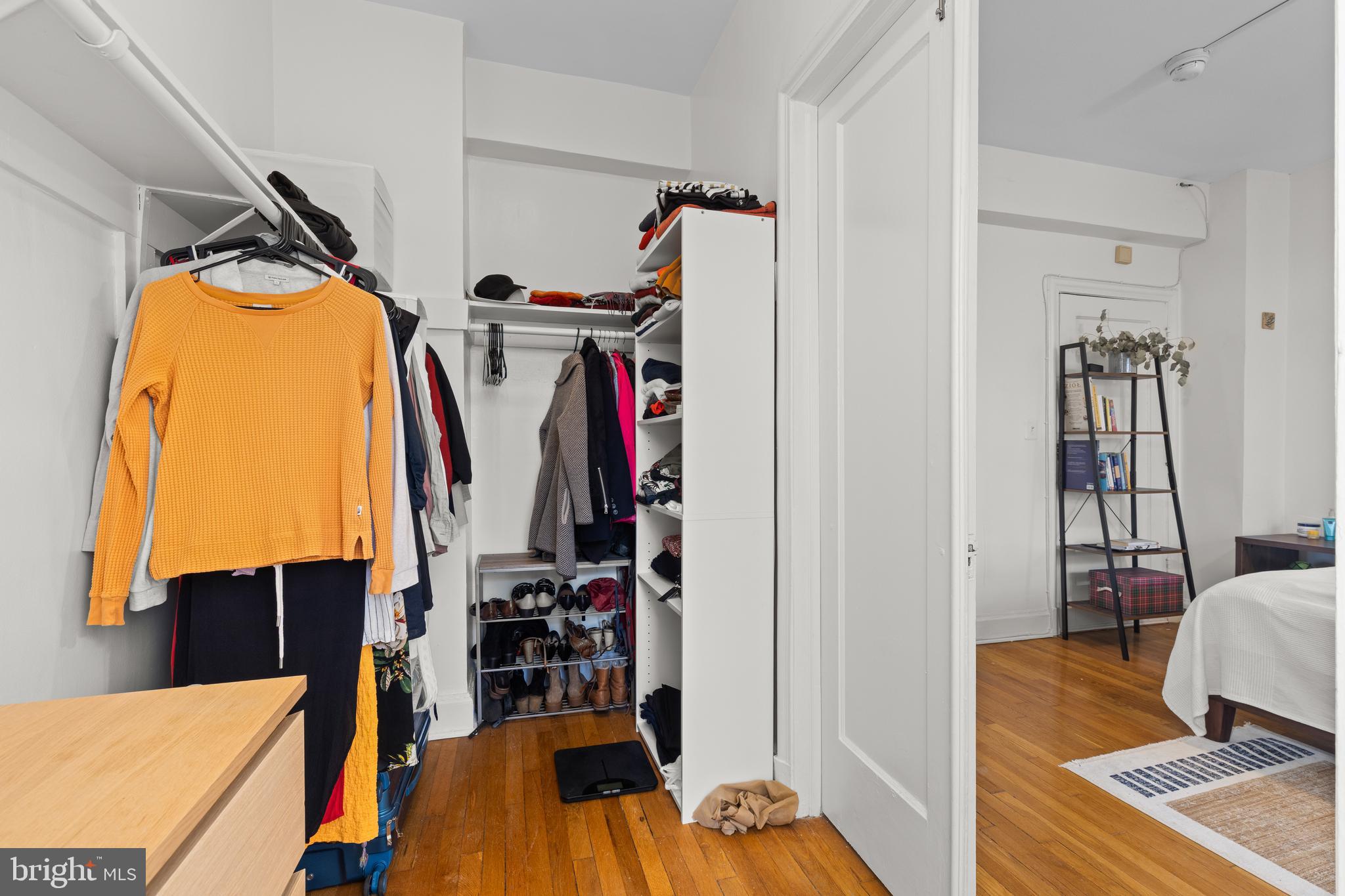 2032 Belmont Road Northwest, Unit 204 Washington, DC 20009 - Photo 11 of 25 a view of walk in closet with clothes and shoes