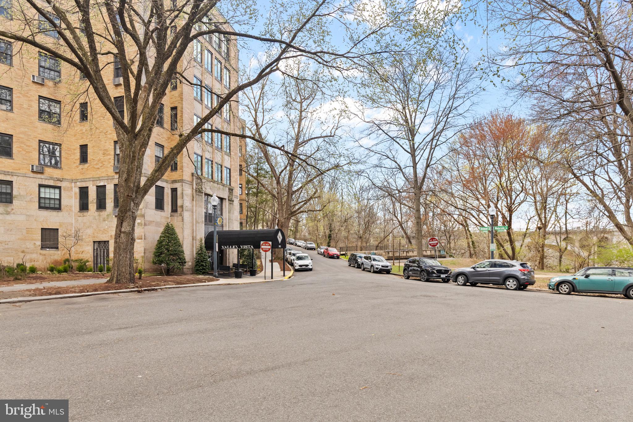2032 Belmont Road Northwest, Unit 204 Washington, DC 20009 - Photo 2 of 25 a view of road with card and parked
