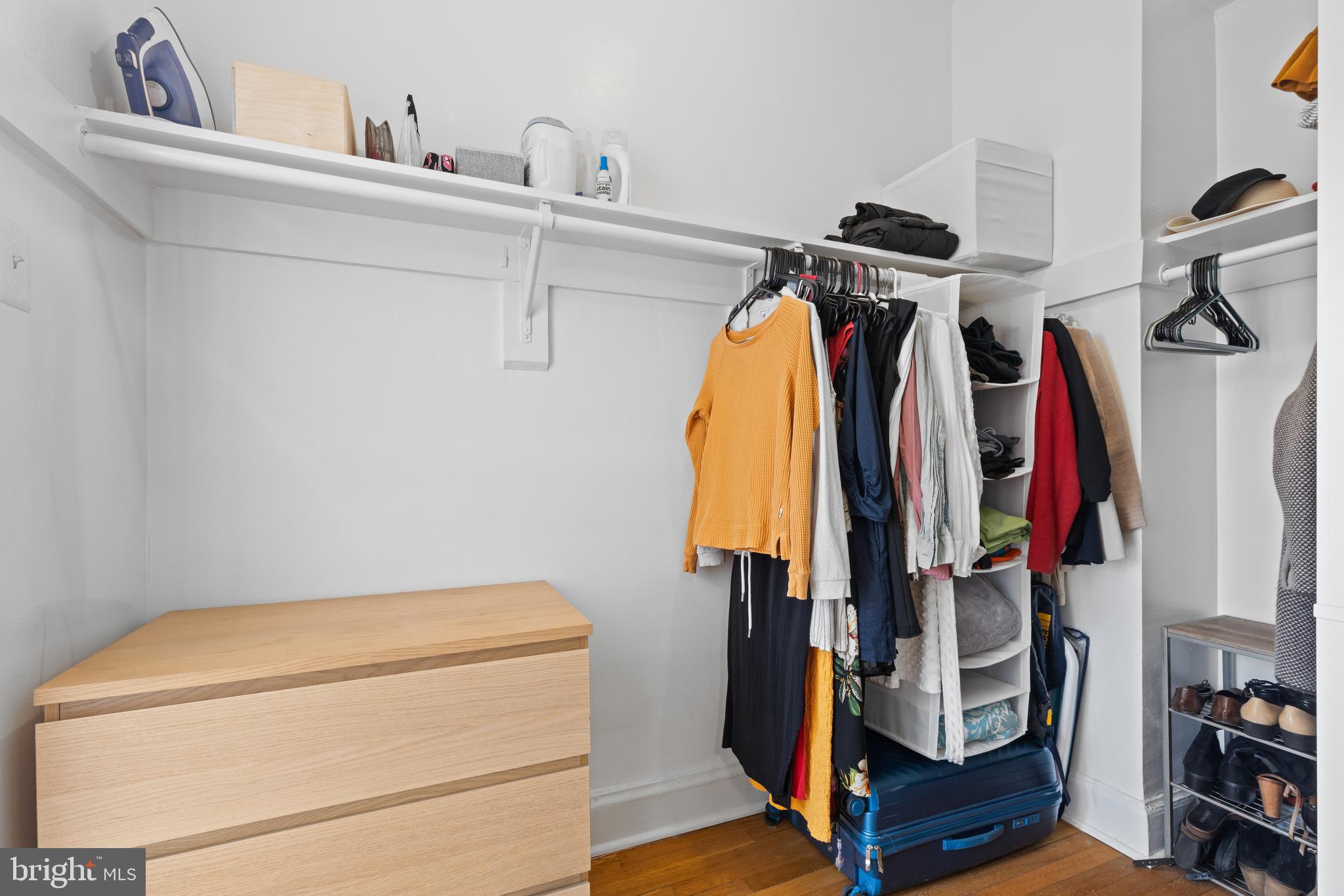 2032 Belmont Road Northwest, Unit 204 Washington, DC 20009 - Photo 9 of 25 a view of walk in closet with clothes and shoes