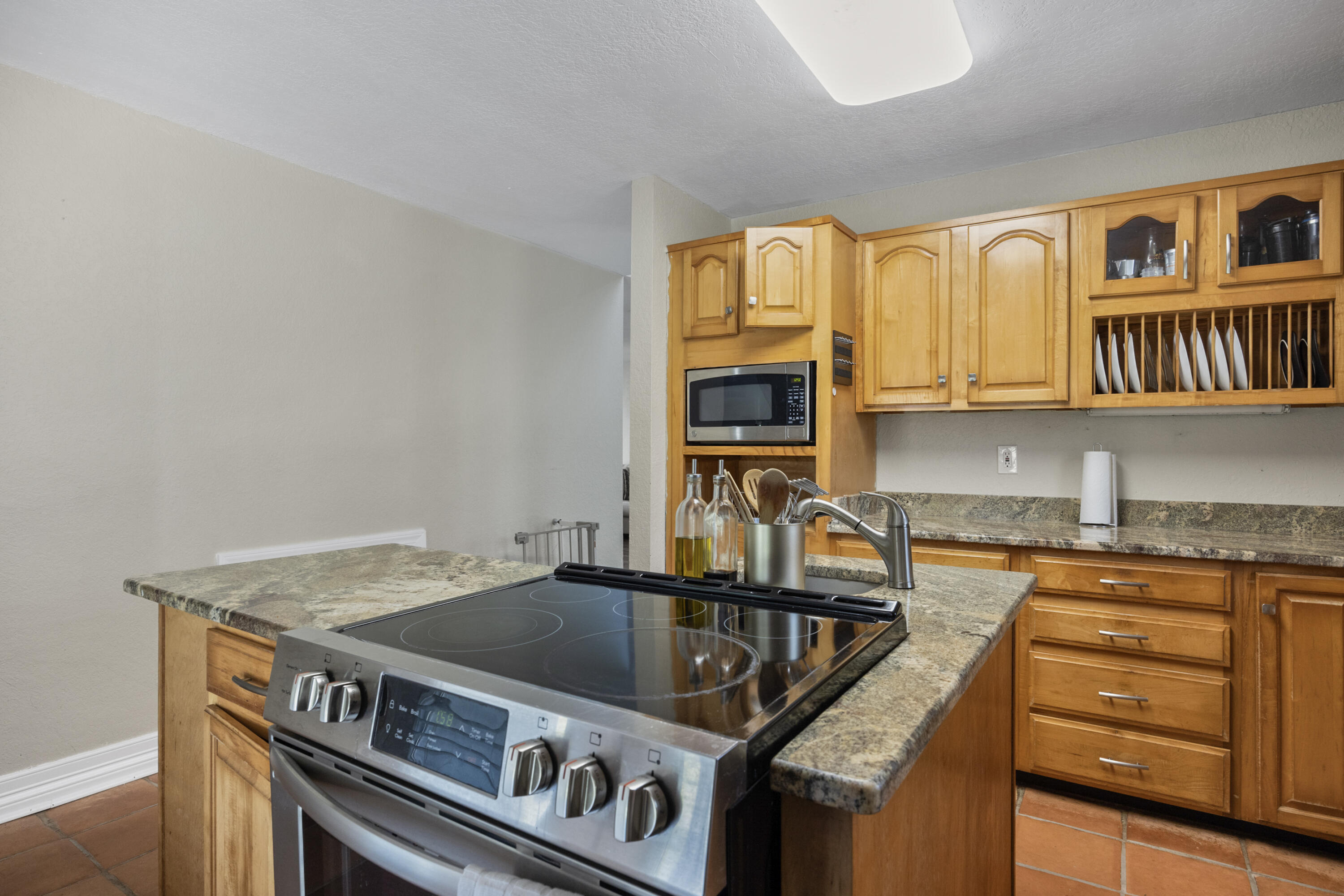 6106 Barnes Road Crestview, FL 32536 - Photo 12 of 49 a kitchen with granite countertop a stove and a sink