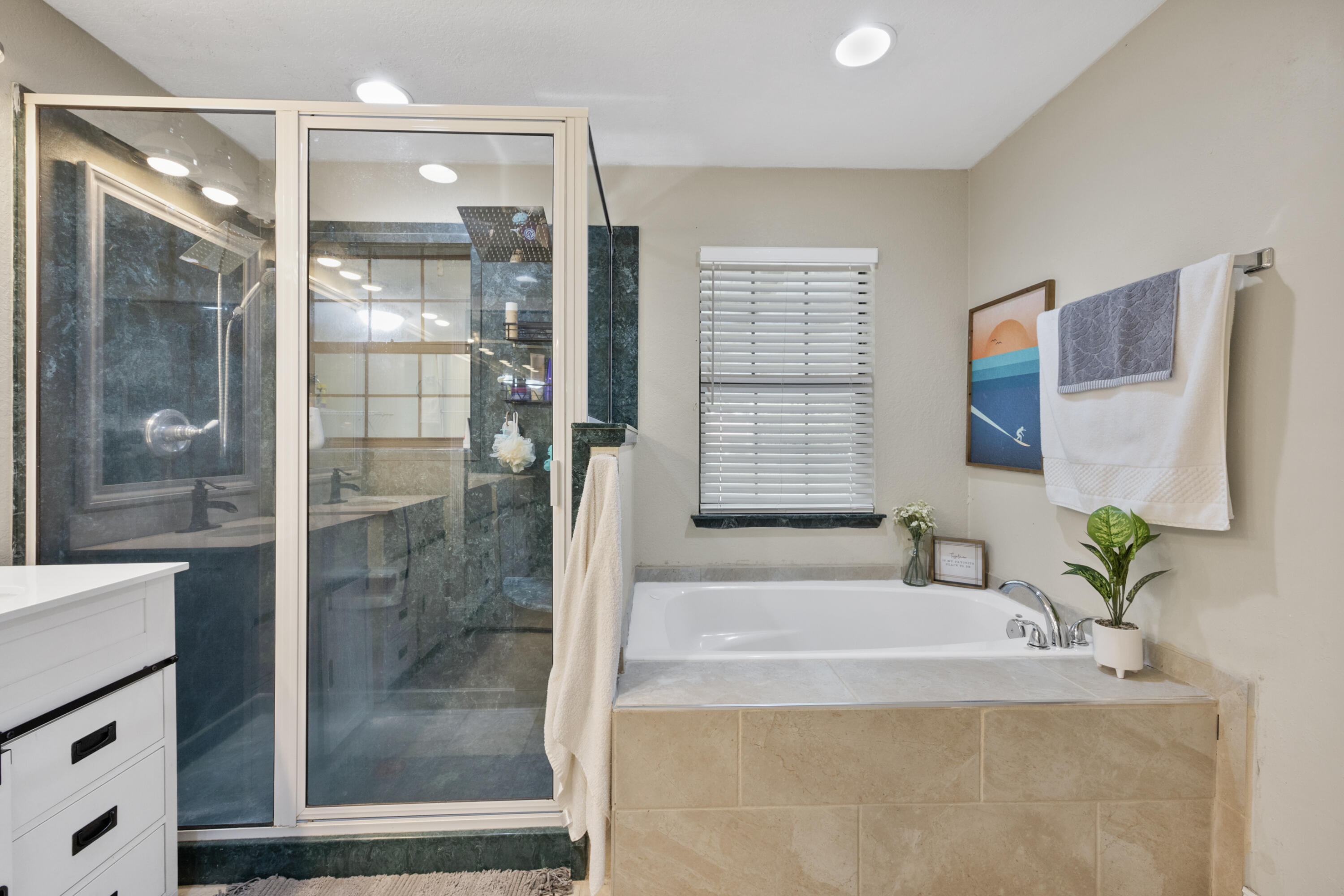 6106 Barnes Road Crestview, FL 32536 - Photo 20 of 49 a bathroom with a granite countertop bathtub and a shower