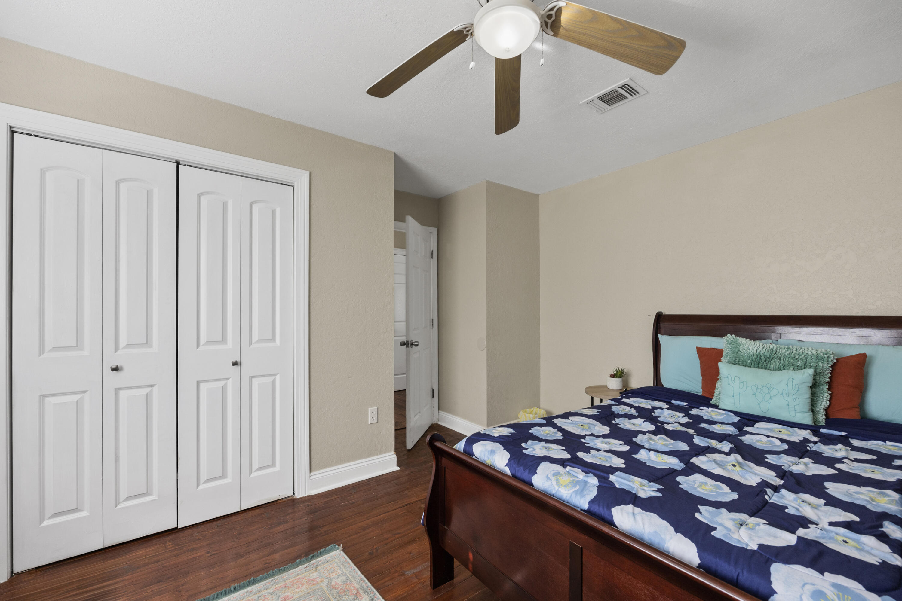 6106 Barnes Road Crestview, FL 32536 - Photo 25 of 49 a bedroom with bed and wooden floor