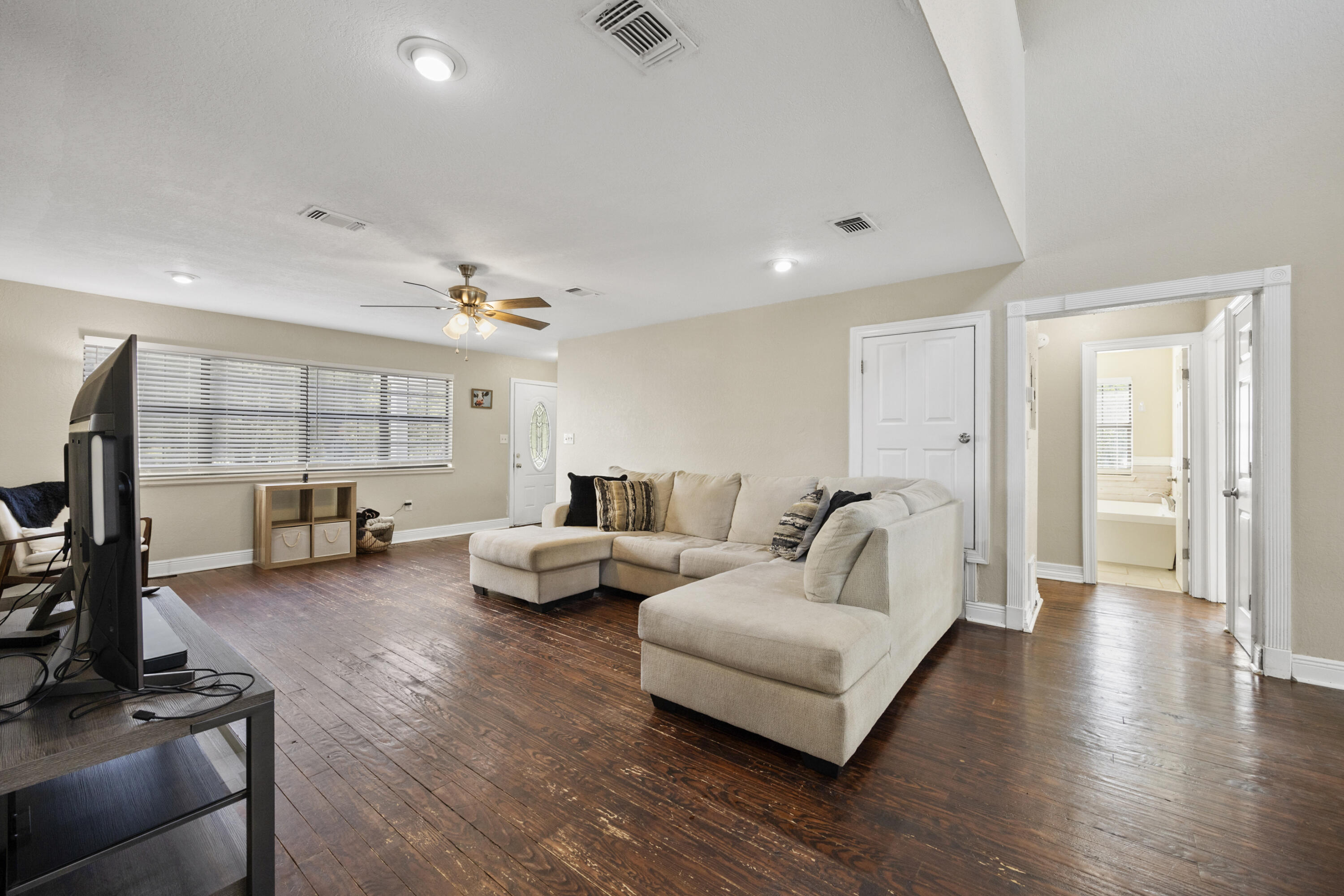 6106 Barnes Road Crestview, FL 32536 - Photo 6 of 49 a living room with furniture and a flat screen tv