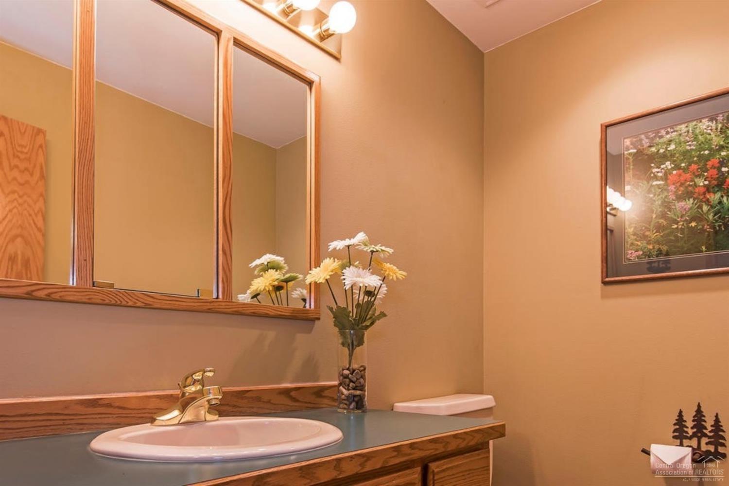 58043 Kinglet Road Sunriver, OR 97707 - Photo 5 of 18 Powder bath on main provides plenty of c
