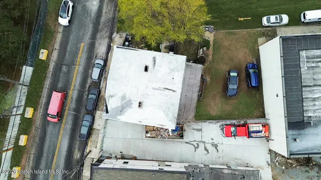 an aerial view of residential house with an outdoor space