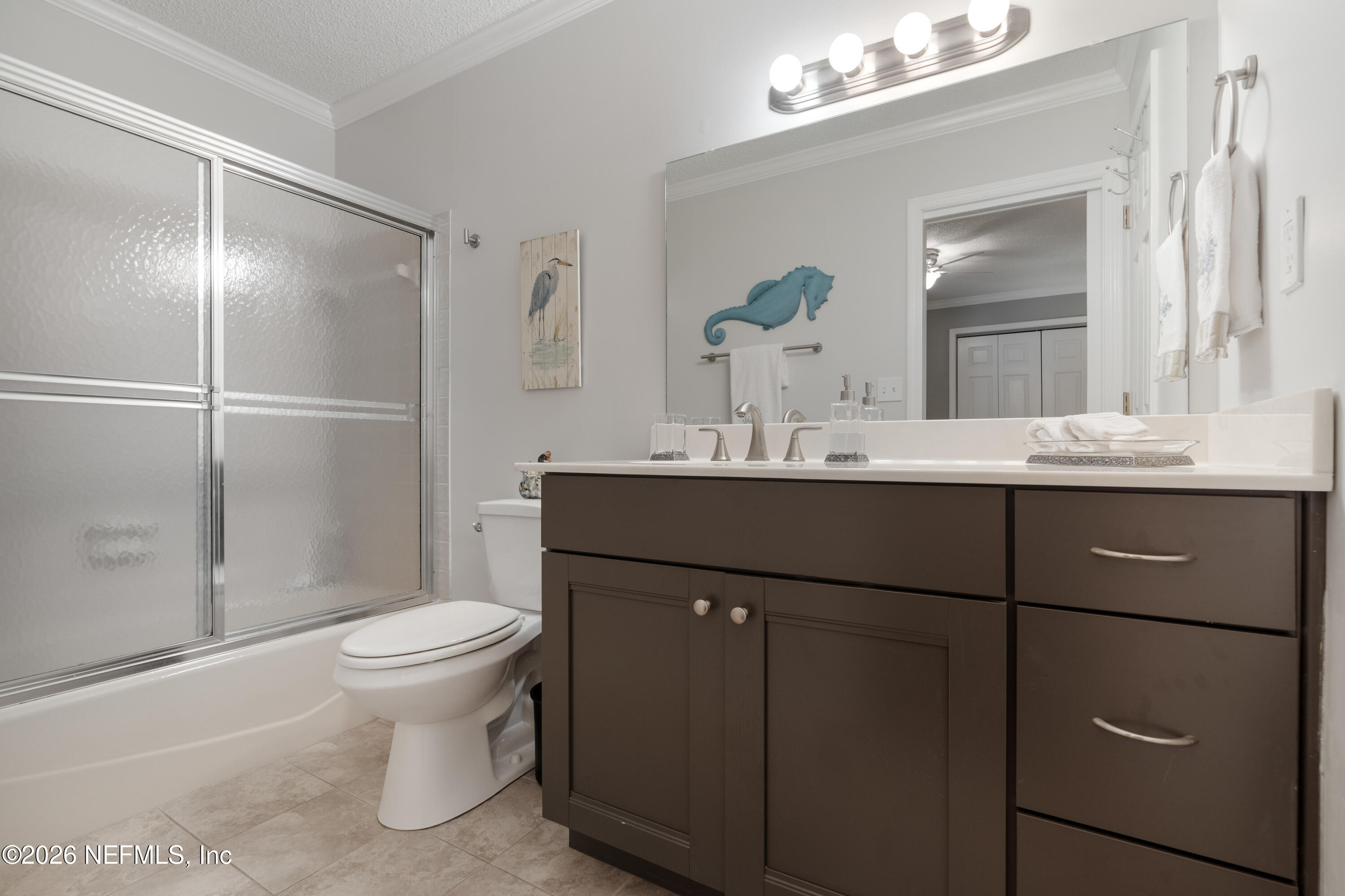 204 Gerado Street, Unit 3 St. Augustine, FL 32080 - Photo 25 of 31 a bathroom with a sink toilet and mirror