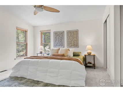 a bedroom with a bed and window