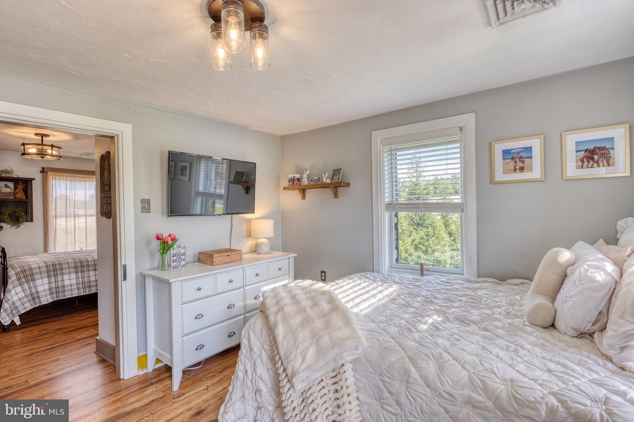 2415 Clearview Lane Spring Grove, PA 17362 - Photo 26 of 149 a bedroom with a bed and wooden floor