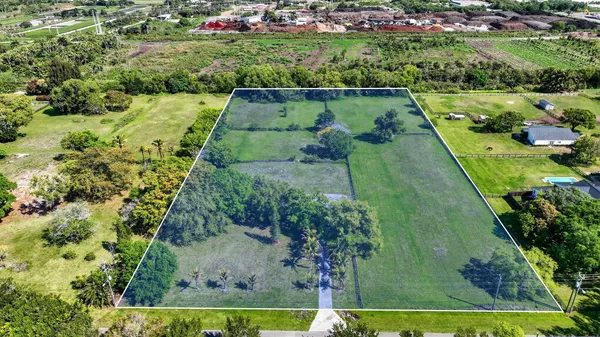 an aerial view of a houses with outdoor space