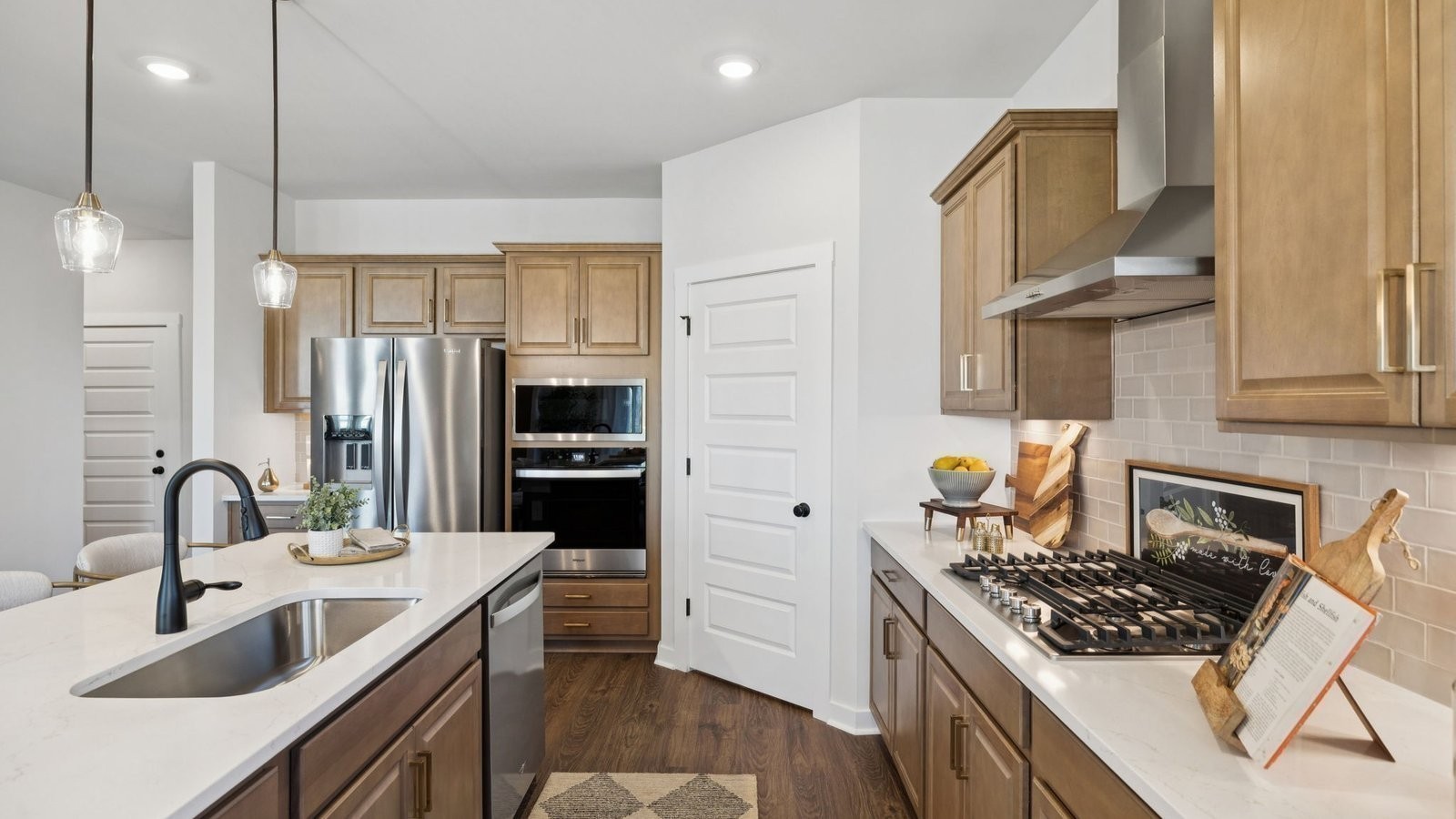 298 Harvest Point Boulevard Spring Hill, TN 37174 - Photo 20 of 70 a kitchen with stainless steel appliances a sink stove and refrigerator