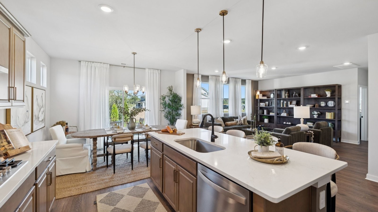 298 Harvest Point Boulevard Spring Hill, TN 37174 - Photo 21 of 70 a open dining room with stainless steel appliances granite countertop a dining table chairs and a living room