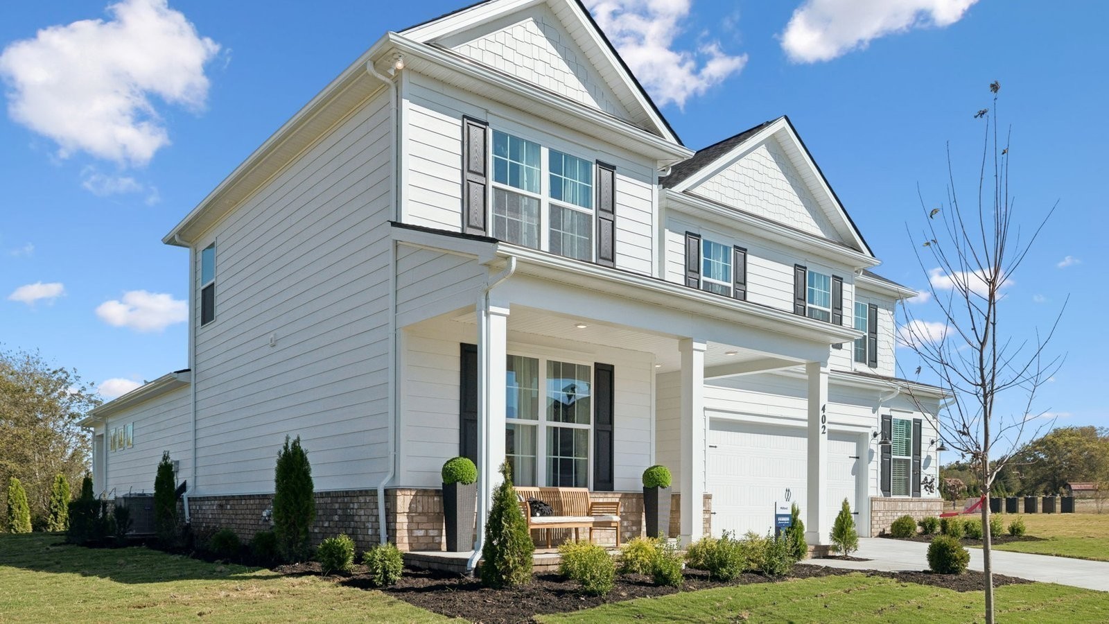 298 Harvest Point Boulevard Spring Hill, TN 37174 - Photo 4 of 70 a front view of a house with a yard