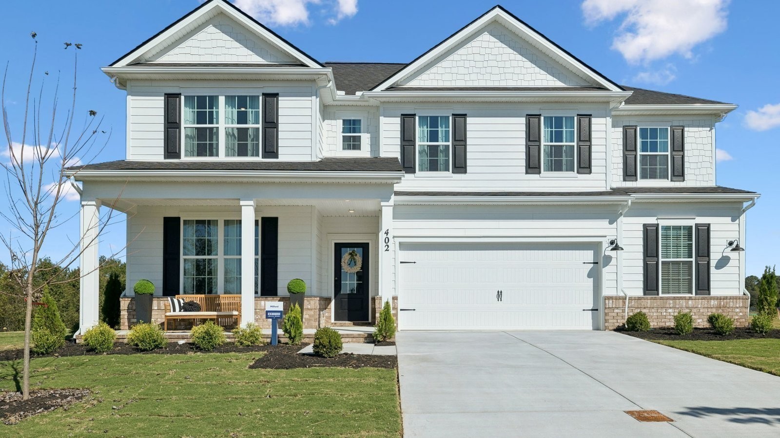 298 Harvest Point Boulevard Spring Hill, TN 37174 - Photo 5 of 70 a front view of a house with a yard