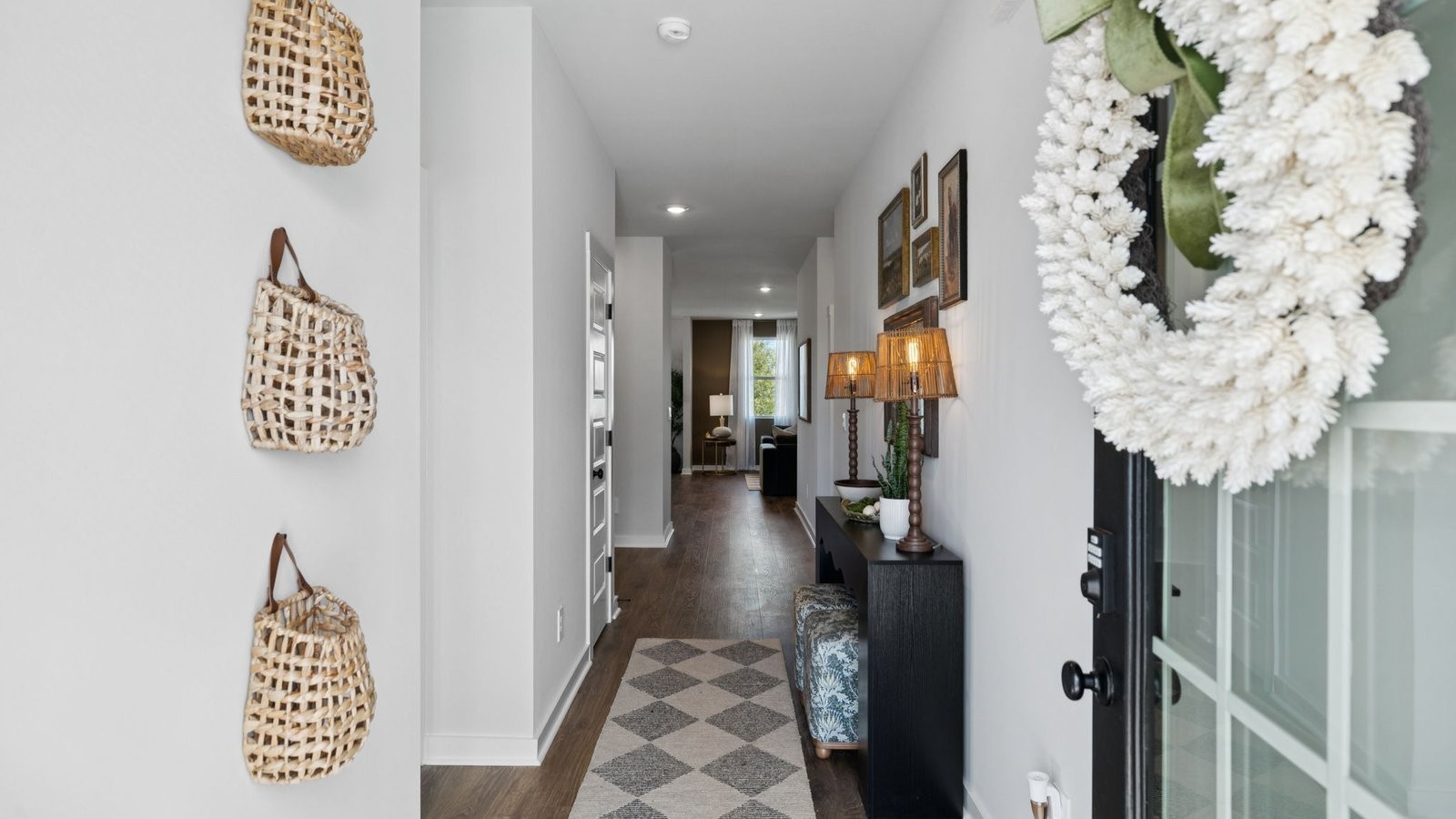298 Harvest Point Boulevard Spring Hill, TN 37174 - Photo 7 of 70 a view of a hallway with wooden floor and entryway