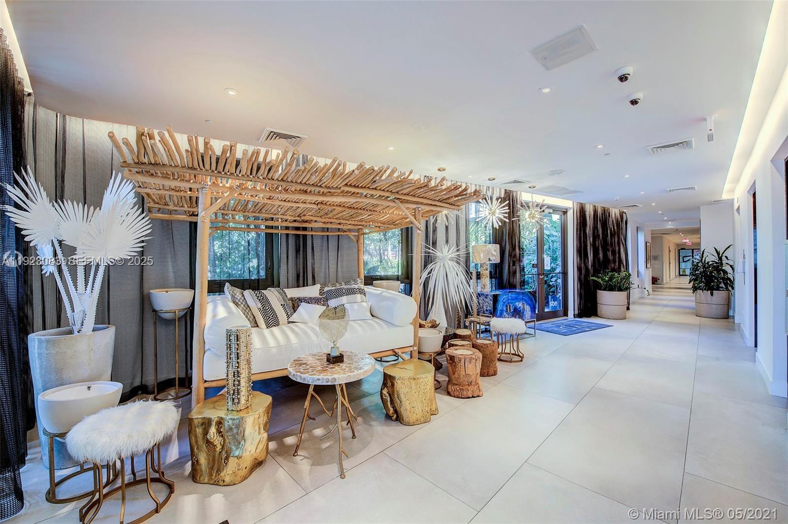 121 Northeast 34th Street, Unit 1604 Miami, FL 33137 - Photo 41 of 53 a living room with furniture and a large window