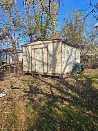 a view of a backyard of the house
