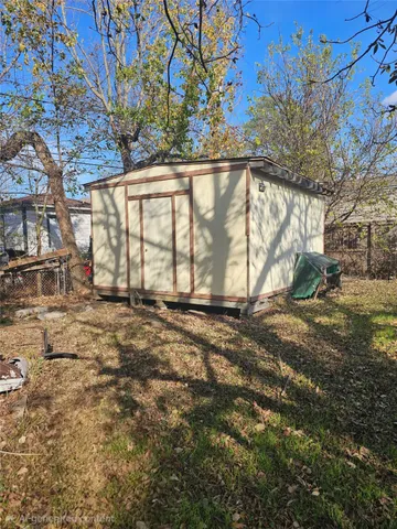 a view of a backyard of the house