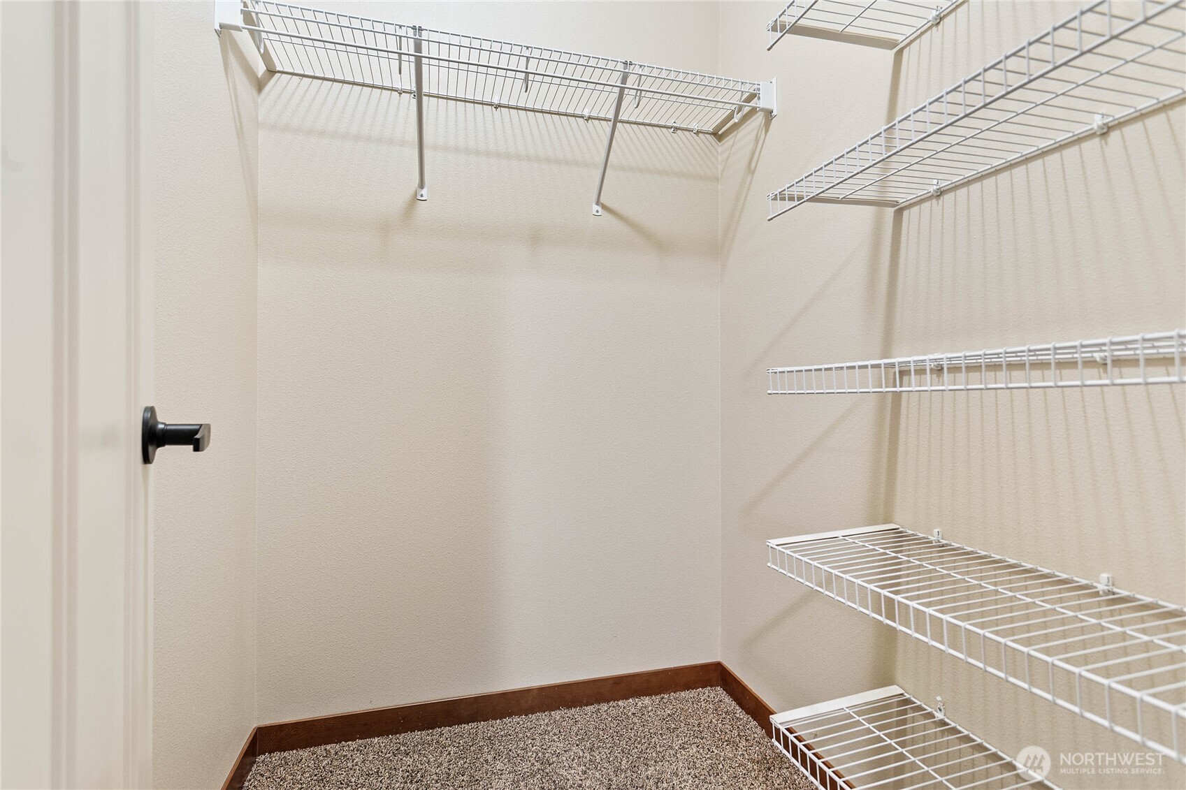 8780 Depot Road, Unit 308 Lynden, WA 98264 - Photo 15 of 36 a view of a room with racks on the wall