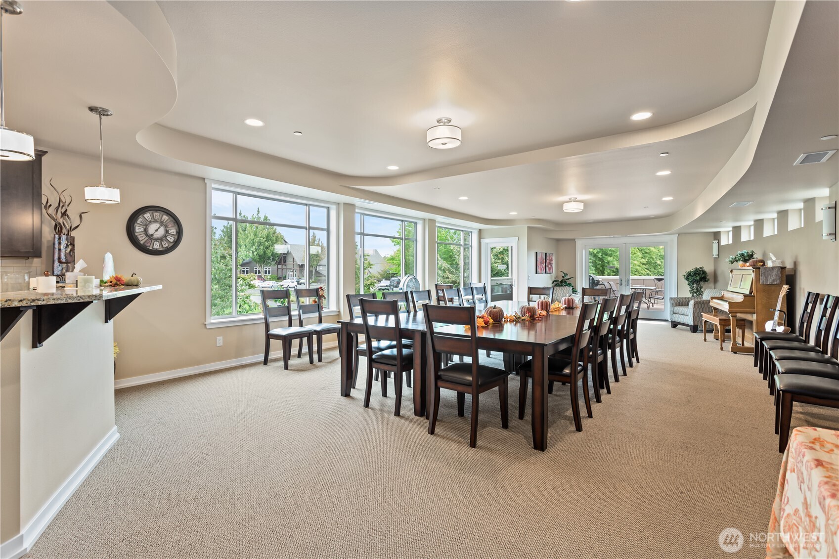 8780 Depot Road, Unit 308 Lynden, WA 98264 - Photo 27 of 36 a group of people sitting in a room with kitchen view