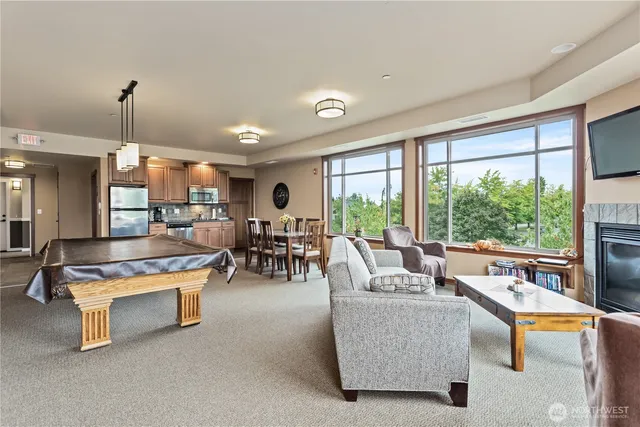 a view of patio with dining table and chairs