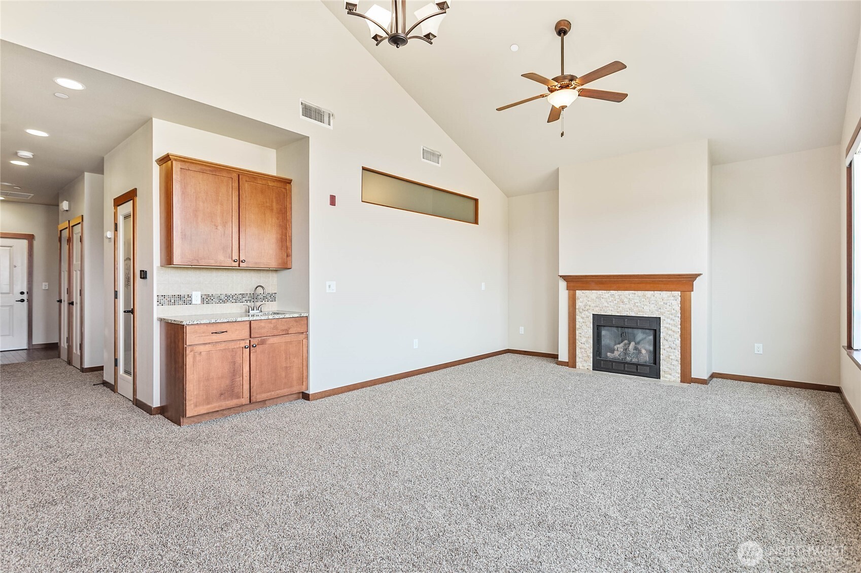 8780 Depot Road, Unit 308 Lynden, WA 98264 - Photo 6 of 36 a view of an empty room with a fireplace