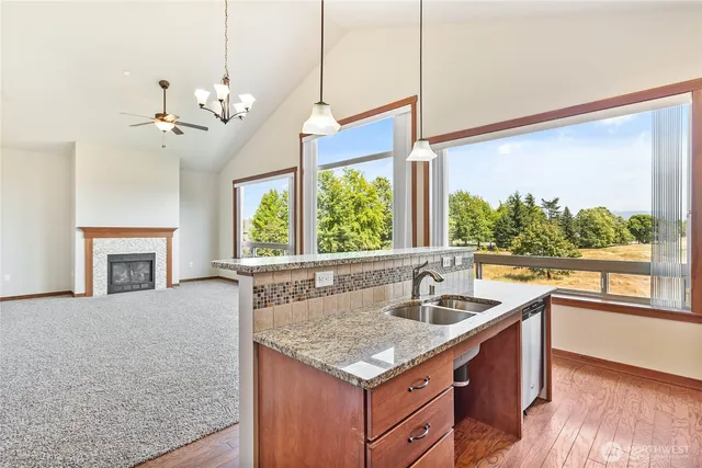 a kitchen with wooden cabinets and white appliances