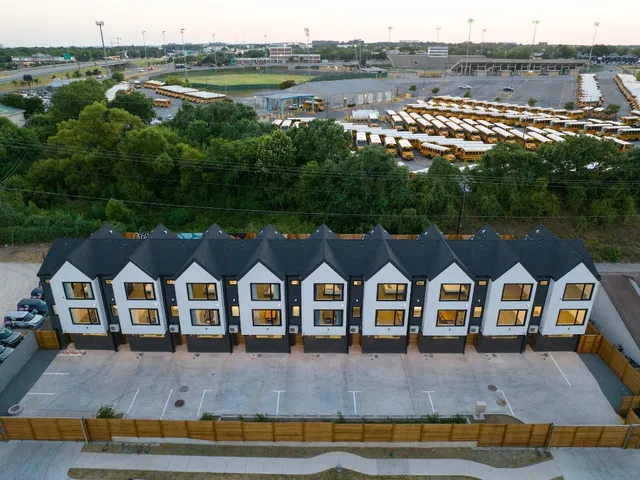 an aerial view of a house with outdoor space and lake view