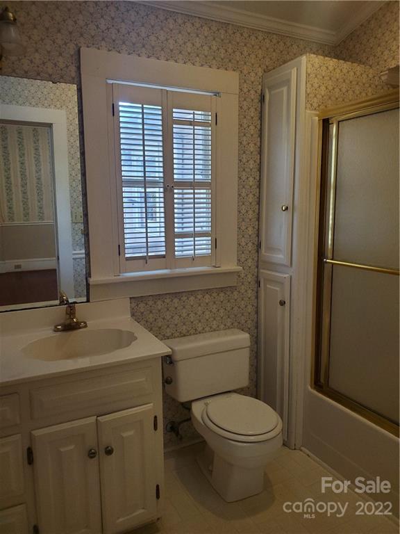 107 South Ridge Avenue, Unit 107 Kannapolis, NC 28083 - Photo 12 of 38 a bathroom with a toilet a sink and shower