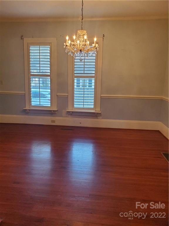 107 South Ridge Avenue, Unit 107 Kannapolis, NC 28083 - Photo 14 of 38 a view of empty room with wooden floor and fan