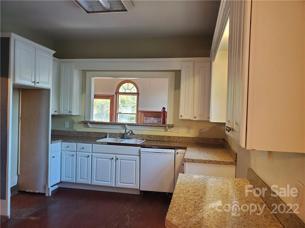 107 South Ridge Avenue, Unit 107 Kannapolis, NC 28083 - Photo 16 of 38 a large bathroom with a granite countertop sink and a mirror