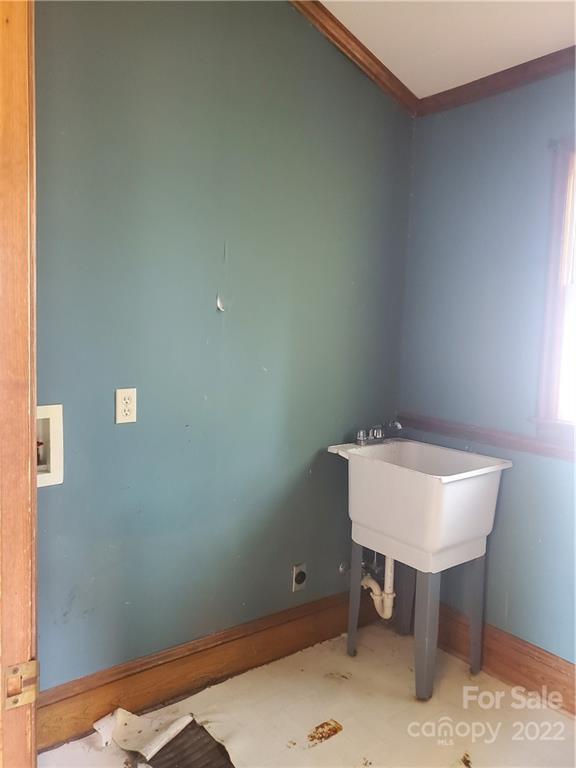 107 South Ridge Avenue, Unit 107 Kannapolis, NC 28083 - Photo 22 of 38 a bathroom with a sink and a mirror