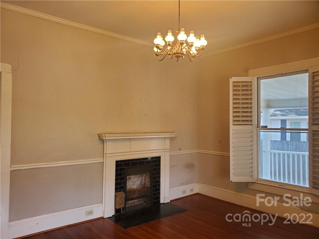 107 South Ridge Avenue, Unit 107 Kannapolis, NC 28083 - Photo 3 of 38 a view of a livingroom with a fireplace and window