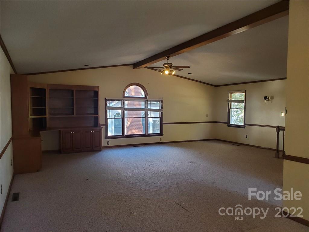 107 South Ridge Avenue, Unit 107 Kannapolis, NC 28083 - Photo 31 of 38 an empty room with windows