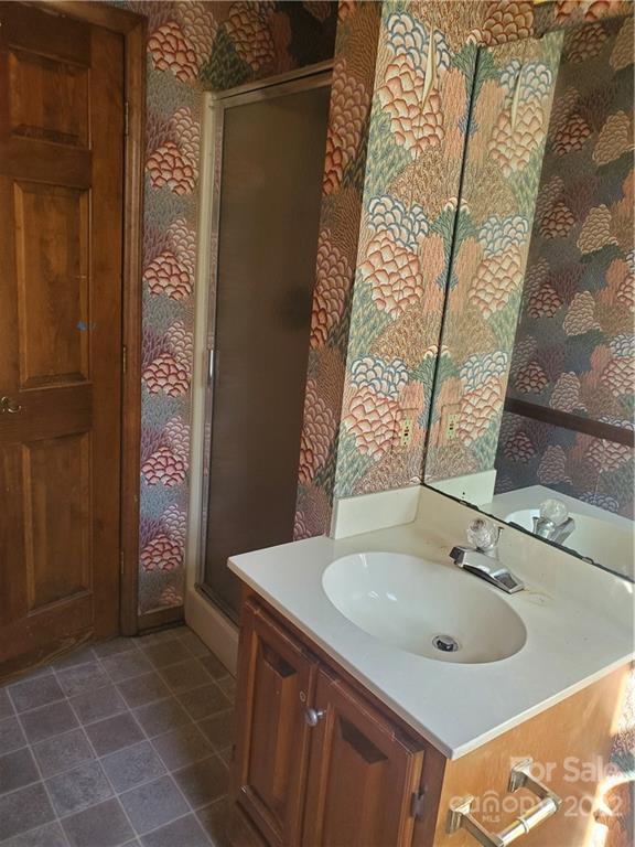 107 South Ridge Avenue, Unit 107 Kannapolis, NC 28083 - Photo 34 of 38 a bathroom with a sink and a mirror