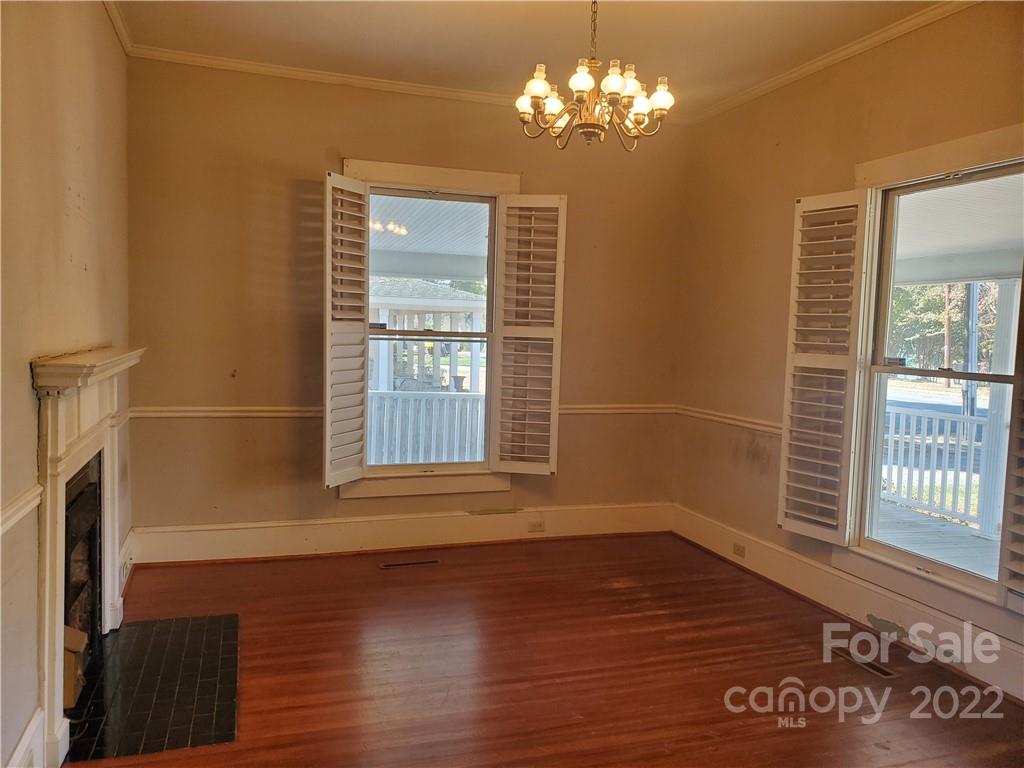 107 South Ridge Avenue, Unit 107 Kannapolis, NC 28083 - Photo 4 of 38 a view of empty room with wooden floor and fan