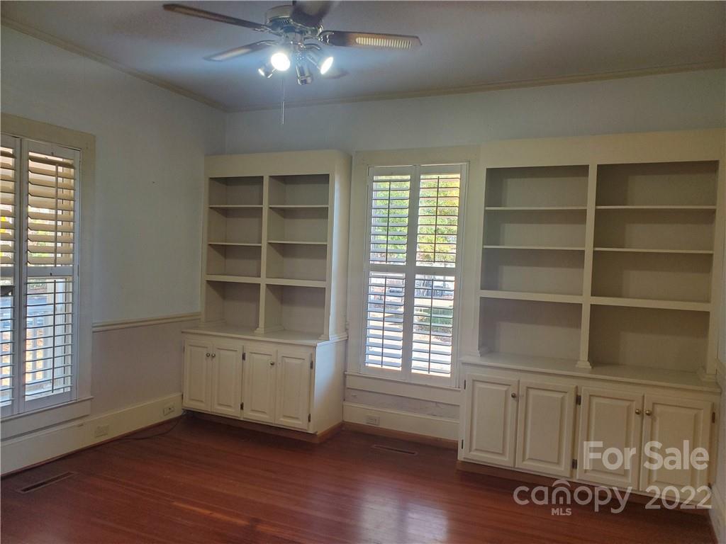107 South Ridge Avenue, Unit 107 Kannapolis, NC 28083 - Photo 5 of 38 a view of an empty room with a window and wooden floor