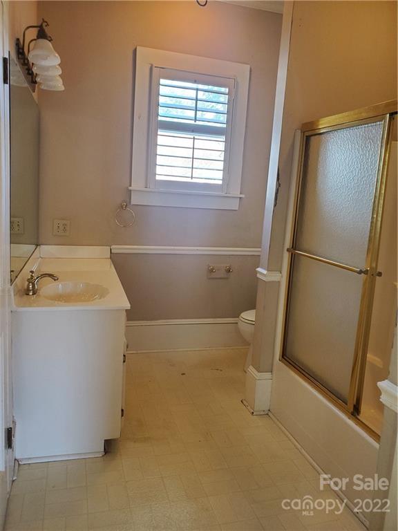 107 South Ridge Avenue, Unit 107 Kannapolis, NC 28083 - Photo 8 of 38 a bathroom with a sink a toilet and a shower