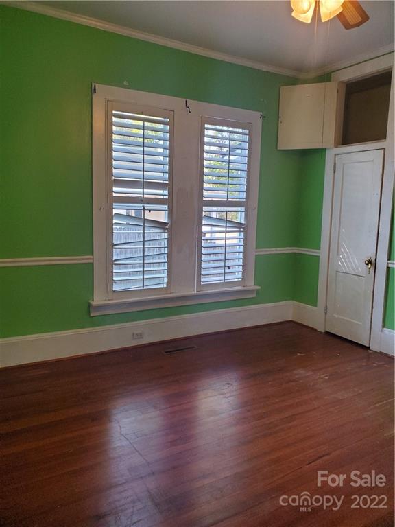 107 South Ridge Avenue, Unit 107 Kannapolis, NC 28083 - Photo 9 of 38 a view of empty room with wooden floor and fan