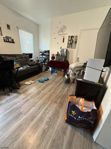 a bedroom with bed and window